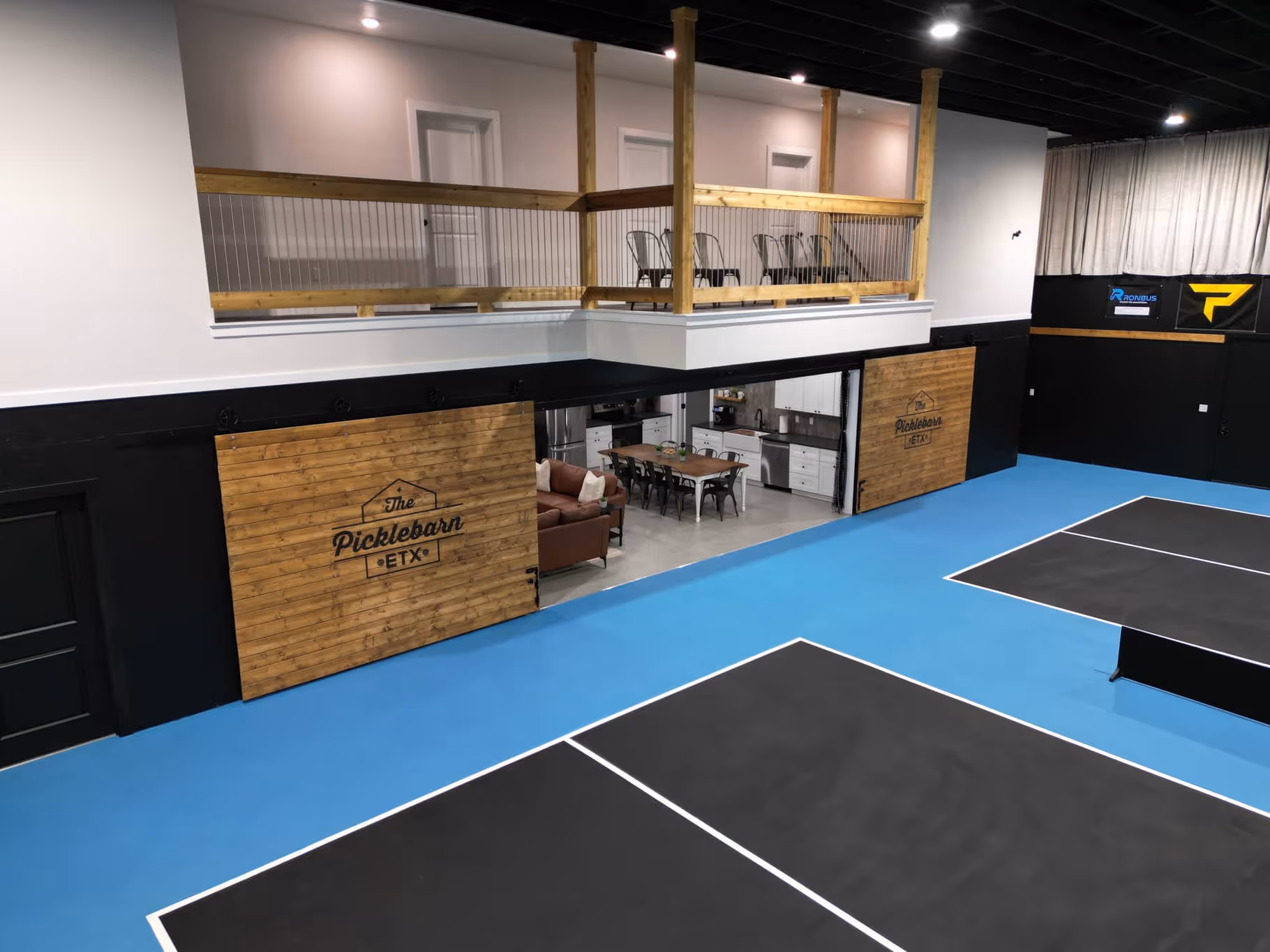 The Picklebarn ETX Airbnb balcony overlooking pickleball courts