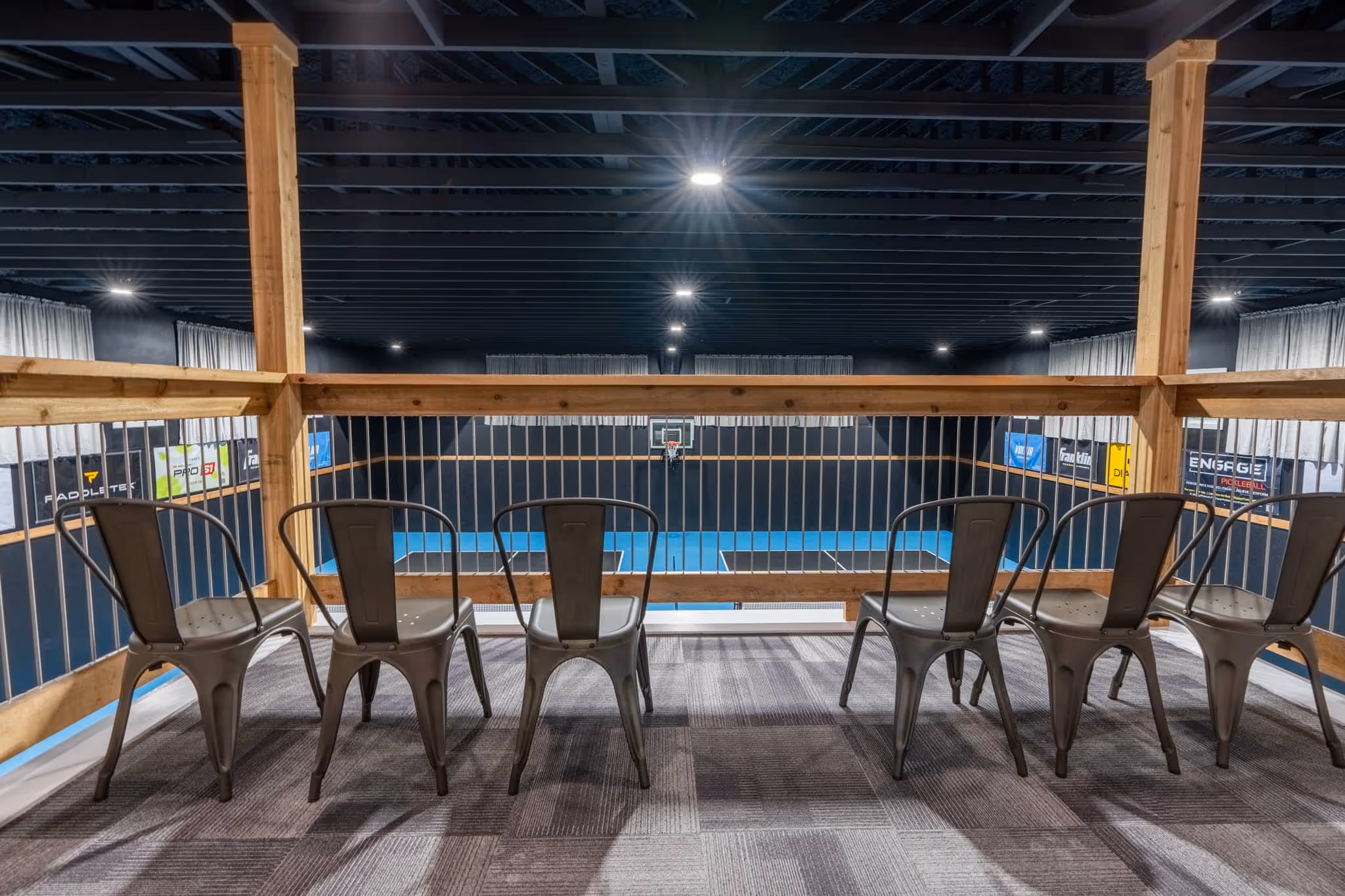 The Picklebarn ETX Airbnb balcony off bedrooms overlooking pickleball indoor courts